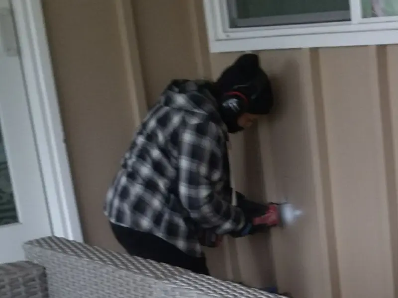 Professional electrician installing an exterior outlet in Lakeside